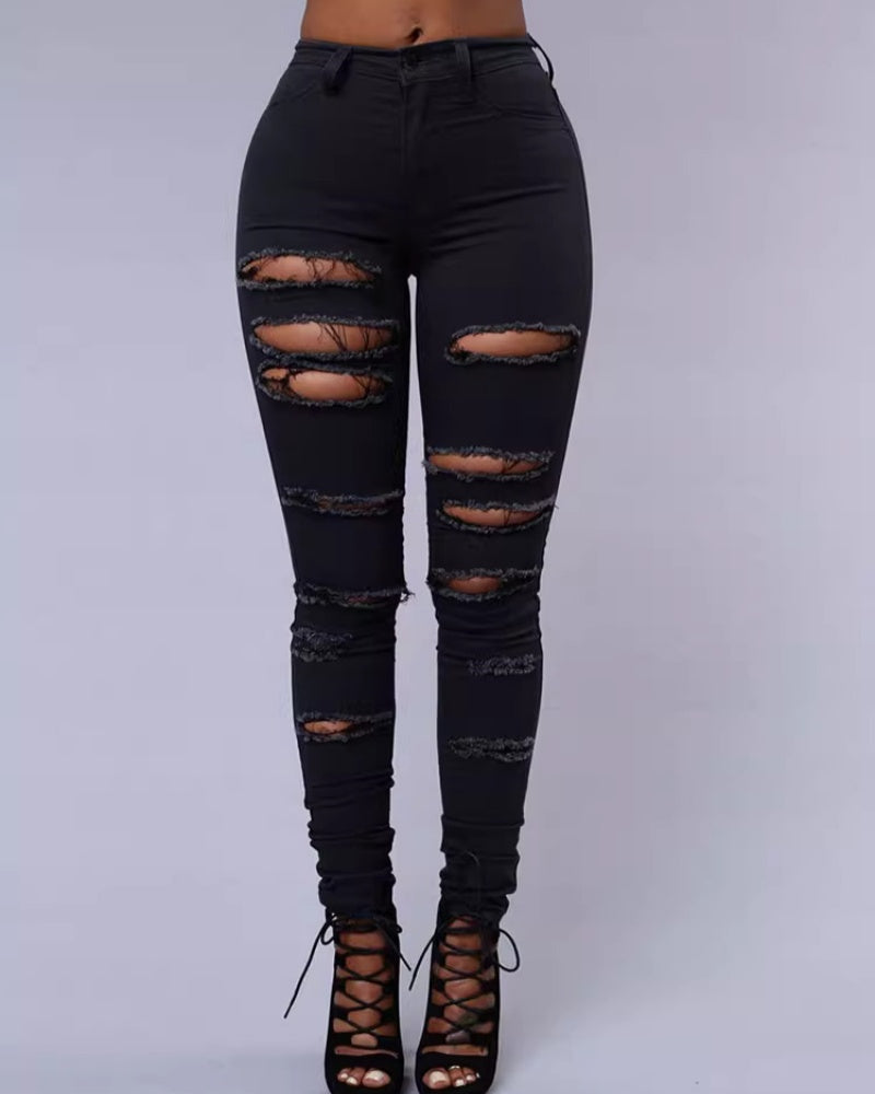 Jeans ajustados rasgados de tiro alto con elasticidad