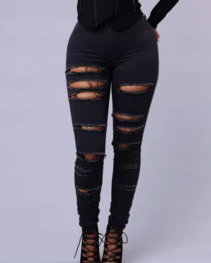 Jeans ajustados rasgados de tiro alto con elasticidad