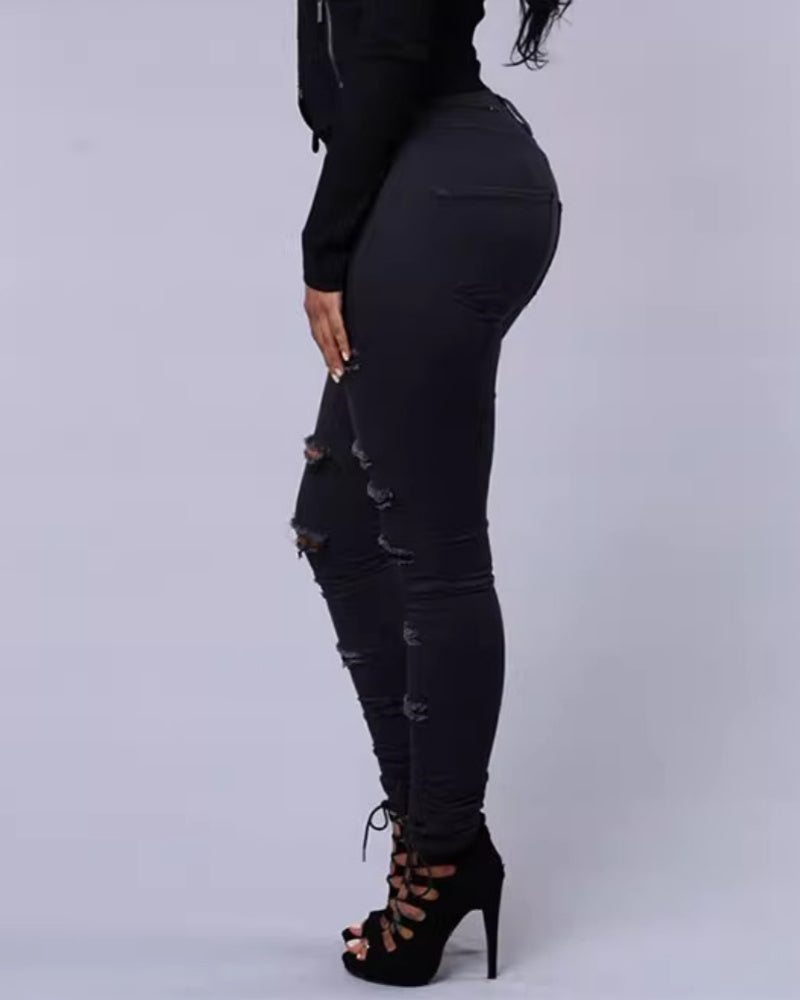 Jeans ajustados rasgados de tiro alto con elasticidad