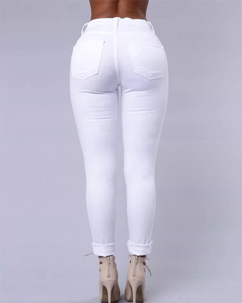 Jeans ajustados rasgados de tiro alto con elasticidad