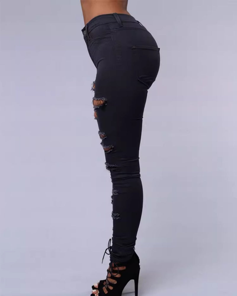 Jeans ajustados rasgados de tiro alto con elasticidad