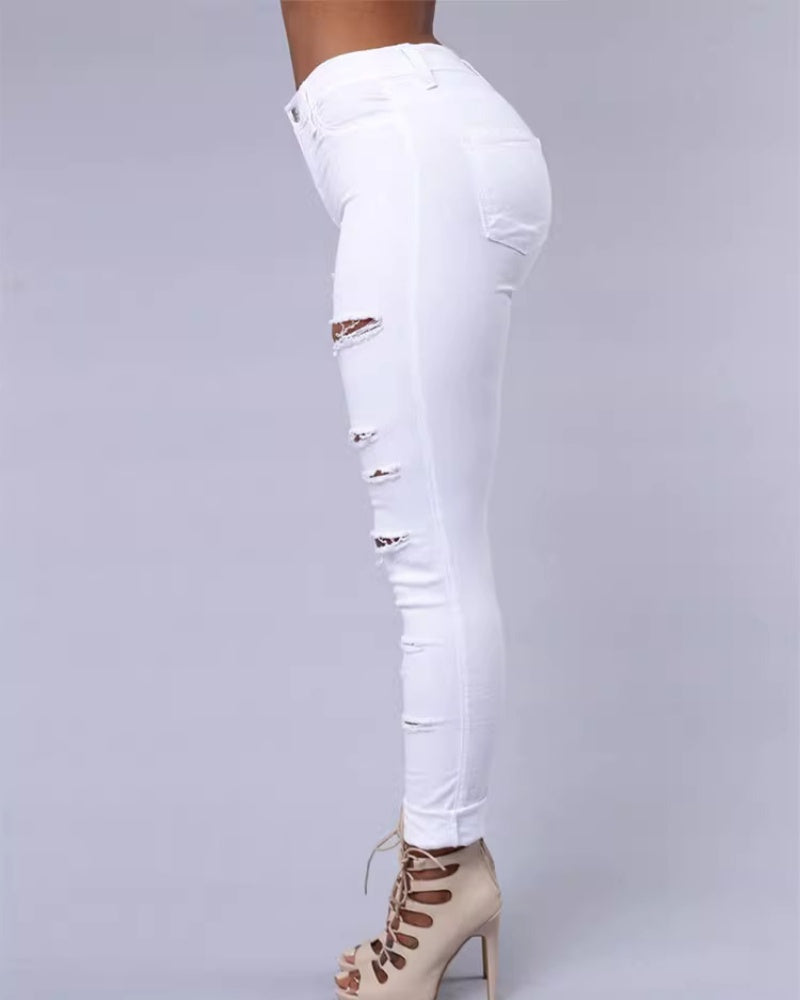 Jeans ajustados rasgados de tiro alto con elasticidad